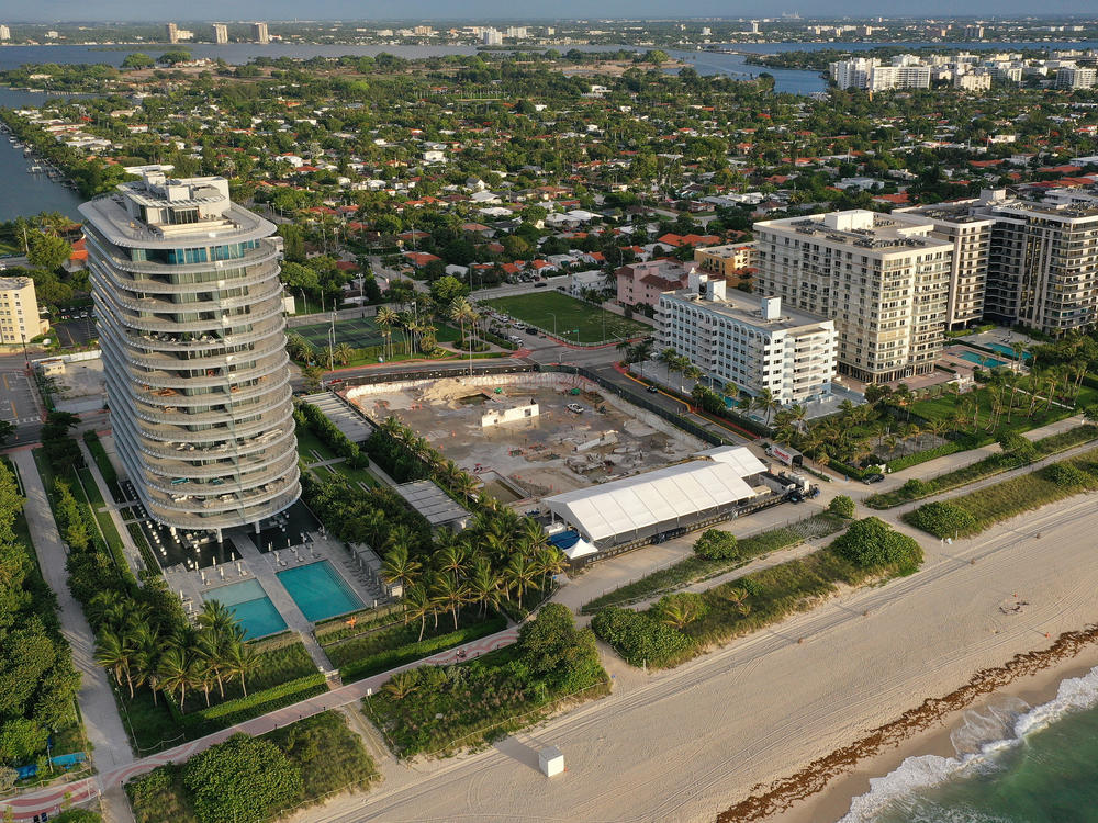 In an aerial view, a cleared lot where the 12-story Champlain Towers South condo building once stood is seen on June 22, 2022, in Surfside, Fla., a year after the tragic event where 98 people died when the building partially collapsed in 2021.