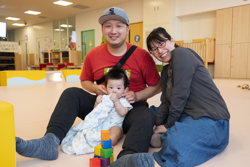 Yudai and Hiromi Kumamoto, and their son Hideyuki at a city-run child care center. The family moved to Akashi from Nara city to take advantage of the child care policies.