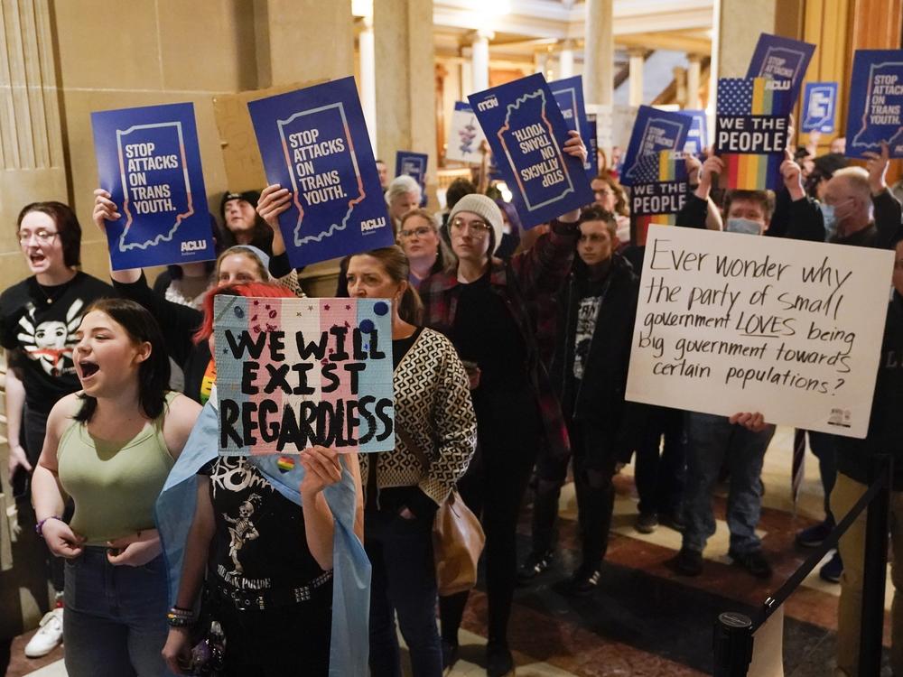 Protesters stand outside of the Senate chamber at the Indiana Statehouse on Feb. 22, 2023, in Indianapolis.