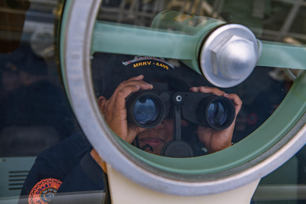 A members of the Philippine Coast Guard takes part in a simulation during a maritime exercise with Japan and U.S. Coast Guard on June 6, off the coast of Bataan province, western Philippines. The drills that took place in waters facing the South China Sea included maneuverings, maritime law enforcement and search and rescue at sea.