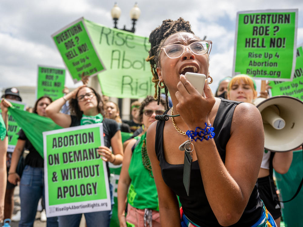 Abortion rights supporters demonstrate outside the U.S. Supreme Court on June 24, 2022, in response to its decision in <em>Dobbs v. Jackson Women's Health Organization</em>.