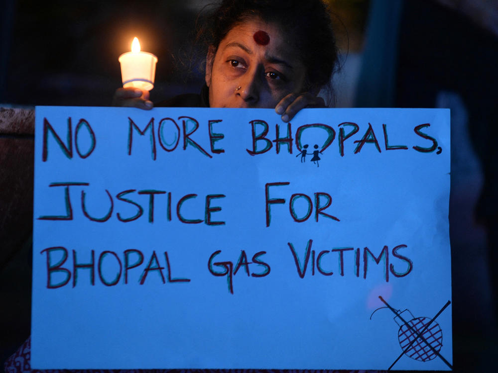 Members of the Bengaluru Solidarity Group in Support of the Bhopal Struggle take part in a candlelight vigil to commemorate the 30th anniversary of the Bhopal gas disaster in Bangalore on December 2, 2014.