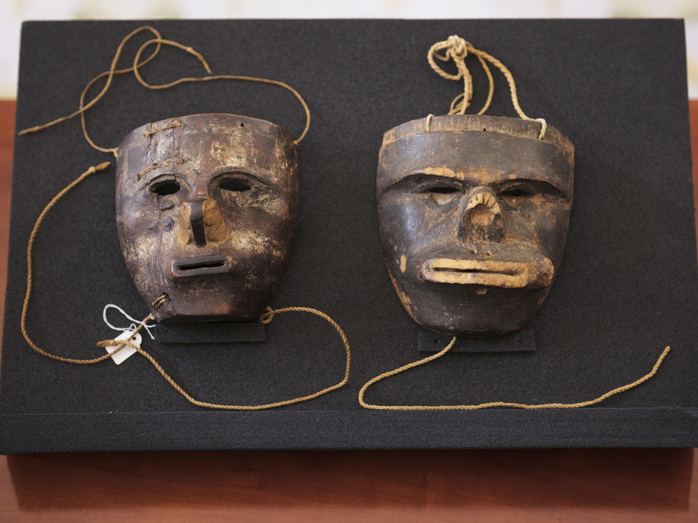 Two masks of the Indigenous community of the Kogi from the Sierra Nevada de Santa Marta in Colombia are displayed at the presidential palace in Berlin on June 16, 2023.