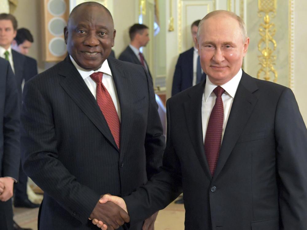 In this handout photo provided by Photo host Agency RIA Novosti, Russian President Vladimir Putin, right, and South African President Cyril Ramaphosa pose for a photo during a meeting with a delegation of African leaders and senior officials in St. Petersburg, Russia, Saturday, June 17, 2023.