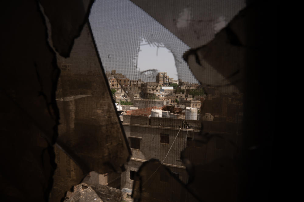 The view out of the window of a residential building in Al Dawah the building has been damaged by shelling and gunshots in this front-line neighborhood.