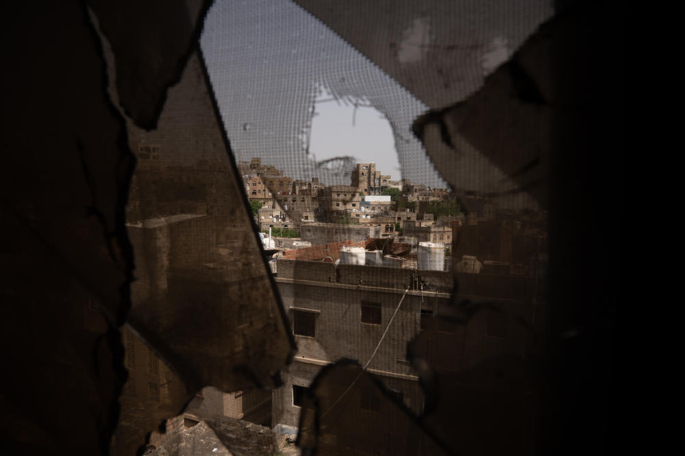 The view out of the window of a residential building in Al Dawah the building has been damaged by shelling and gunshots in this front-line neighborhood.