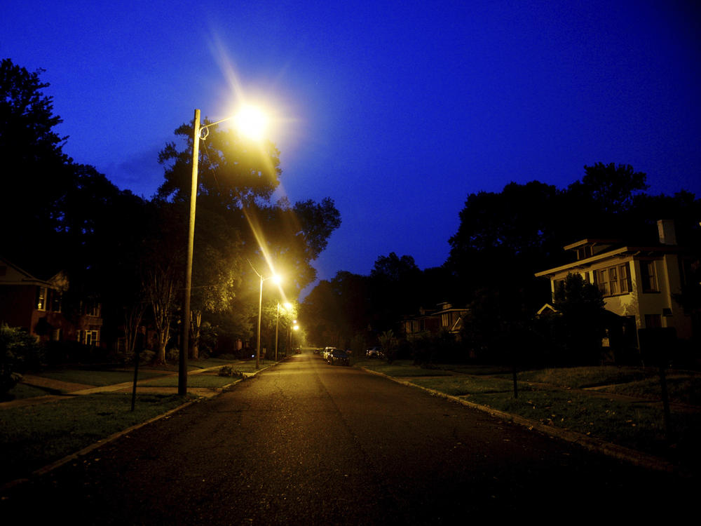 Forrest Avenue, in the South Highland neighborhood, is dark except for streetlights in the early hours of Saturday, June 17, 2023, following a storm, in Shreveport, La.