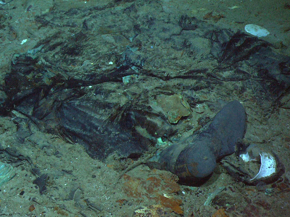 This 2004 photo shows the remains of a coat and boots in the mud on the sea bed near the Titanic's stern.