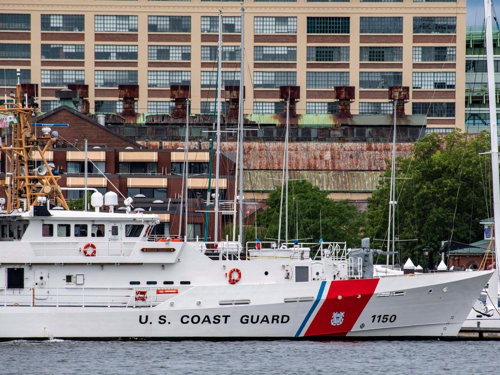 A U.S. Coast Guard vessel sits in port in Boston Harbor on Monday amidst the search for the submersible.