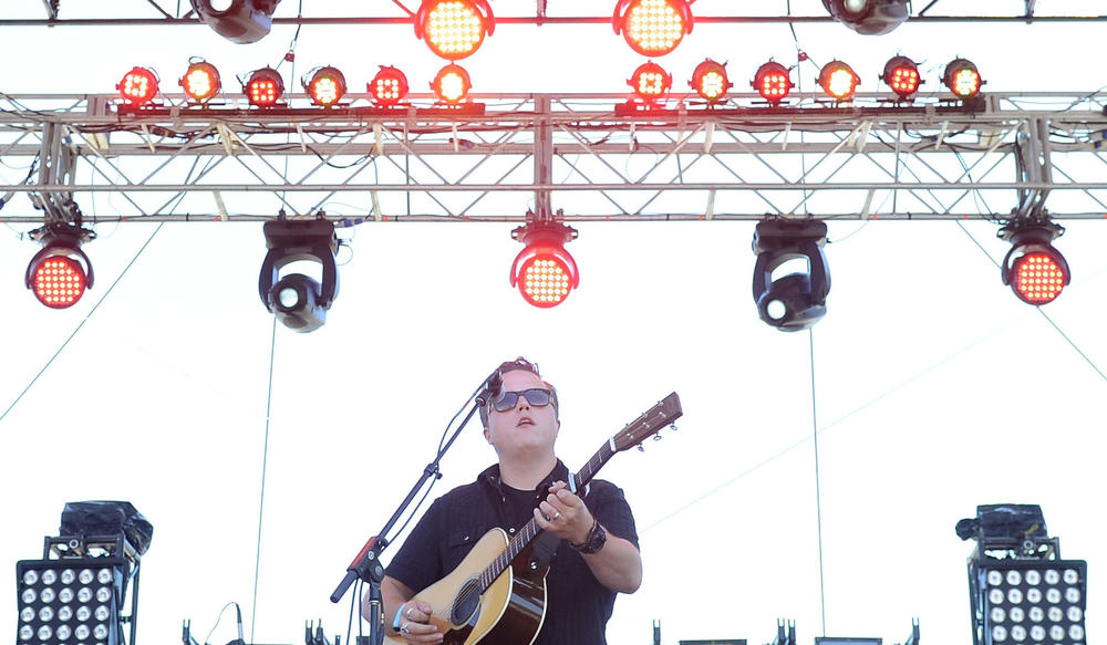 Jason Isbell (center) performs with his band the 400 Unit at Bonnaroo in Manchester, Tenn. on June 14, 2013. Just three days before playing the festival, Isbell released <em>Southeastern</em>, the first album he made after getting sober and the record that revived his career.