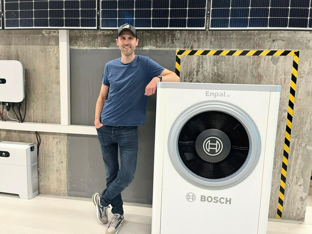 Wolfgang Gründinger heads the renewable energy start-up Enpal and stands next to his company's latest offering: a Bosch heat pump that is capable of heating and cooling a single family home. The cost of electricity needed to power a heat pump is a third cheaper than natural gas.