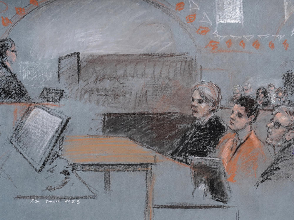 In this artist depiction, Massachusetts Air National Guardsman Jack Teixeira, seated second from right, appears in U.S. District Court, in Boston, April 19, 2023. Teixeira, accused of leaking highly classified military documents on a social media platform, is due back in court on June 21, after being indicted on federal felony charges.