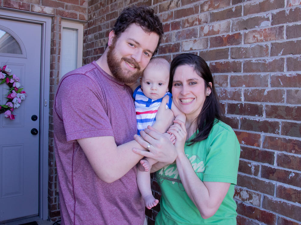 Teacher Karli Myers poses with her husband, Jordan Myers, and their seven-month-old, Luke. Karli spent years stockpiling sick leave in order to have time at home with Luke after he was born.