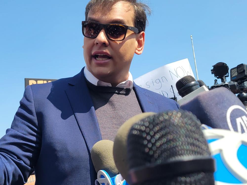 Rep. George Santos (R-NY3) speaking to reporters outside a federal courthouse on Long Island in May after he was charged with 13 federal crimes.