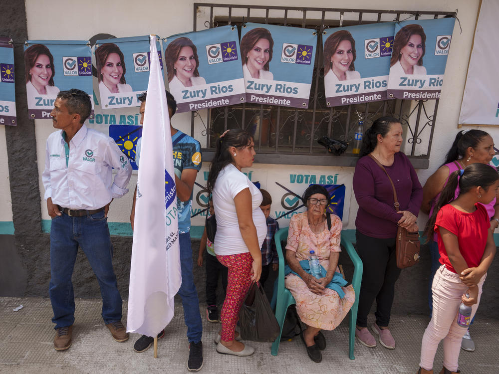 Residents wait for the start of a campaign rally promoting Zury Ríos, presidential candidate for the Valor and Unionista coalition, in Sansare, Guatemala, June 2.
