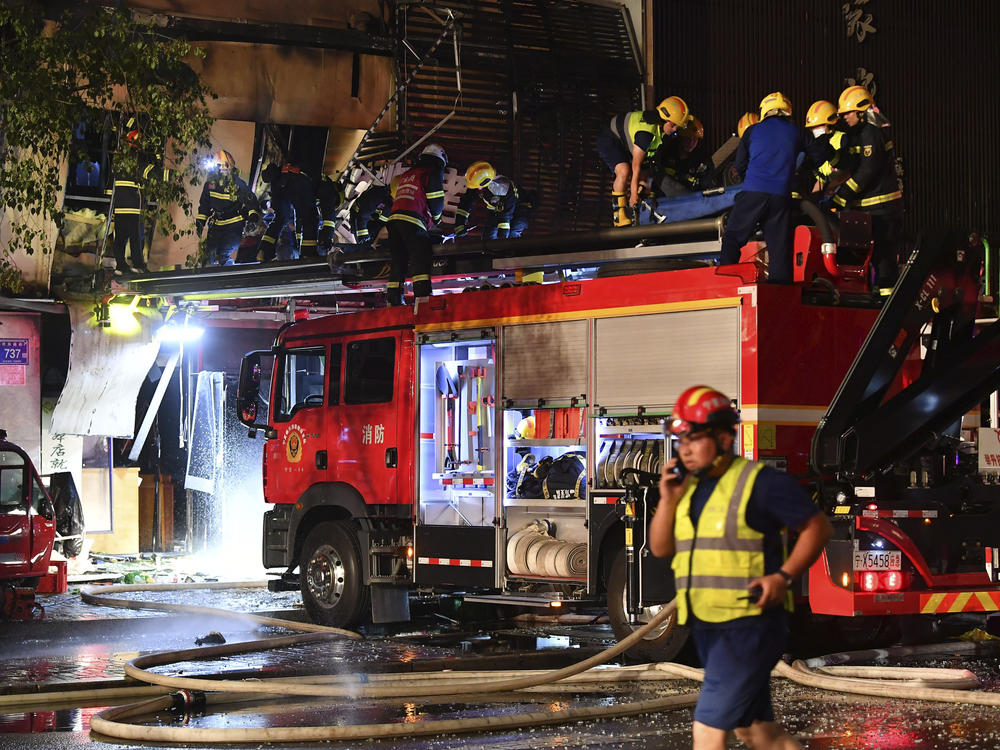 In this photo released by Xinhua News Agency, firefighters work at the site of an explosion at a restaurant in Yinchuan, northwest China's Ningxia Hui Autonomous Region in the early hours of Wednesday, June 21, 2023.
