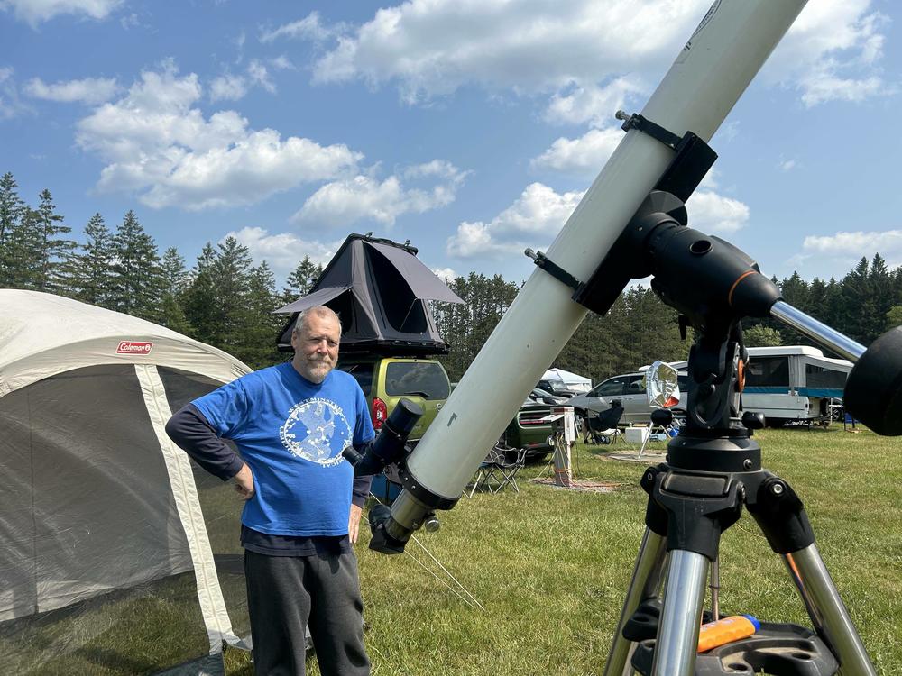 Skip Bird, a retired science teacher, stands next to his telescope last week at Cherry Springs State Park in Pennsylvania.