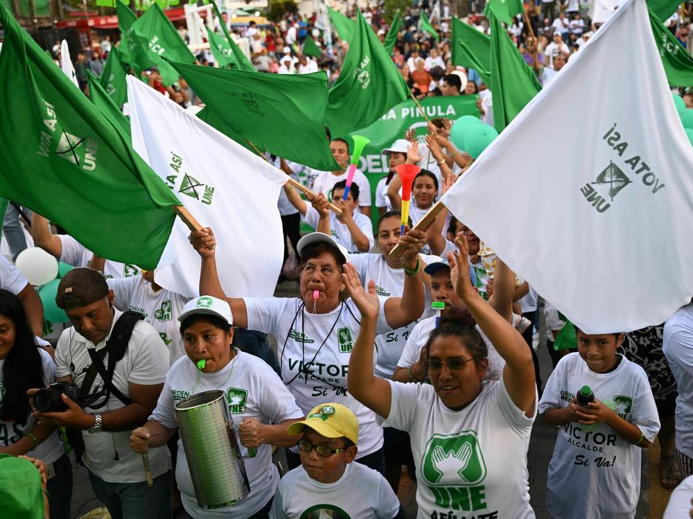 Supporters of Guatemalan candidate for the National Union of Hope party and former first lady, Sandra Torres, attend a campaign rally in Santa Catarina Pinula, Guatemala, on June 17.