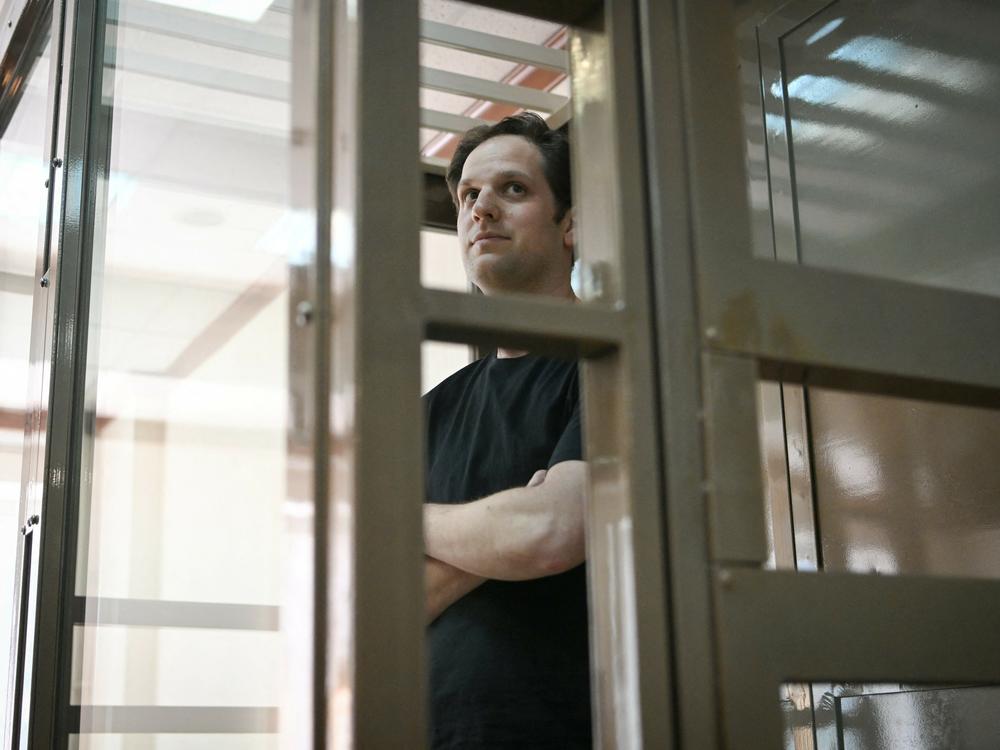 Evan Gershkovich, the U.S. reporter detained on espionage charges in Russia, stands inside a defendants' cage before a hearing to consider an appeal of his extended detention at the Moscow City Court. His appeal was rejected.