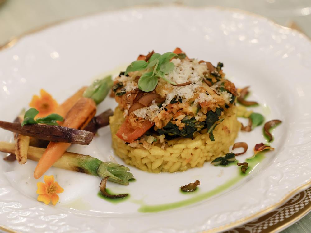 The main course of the dinner includes a stuffed portobello mushroom and creamy saffron-infused risotto. A fish entree is available to order upon request.