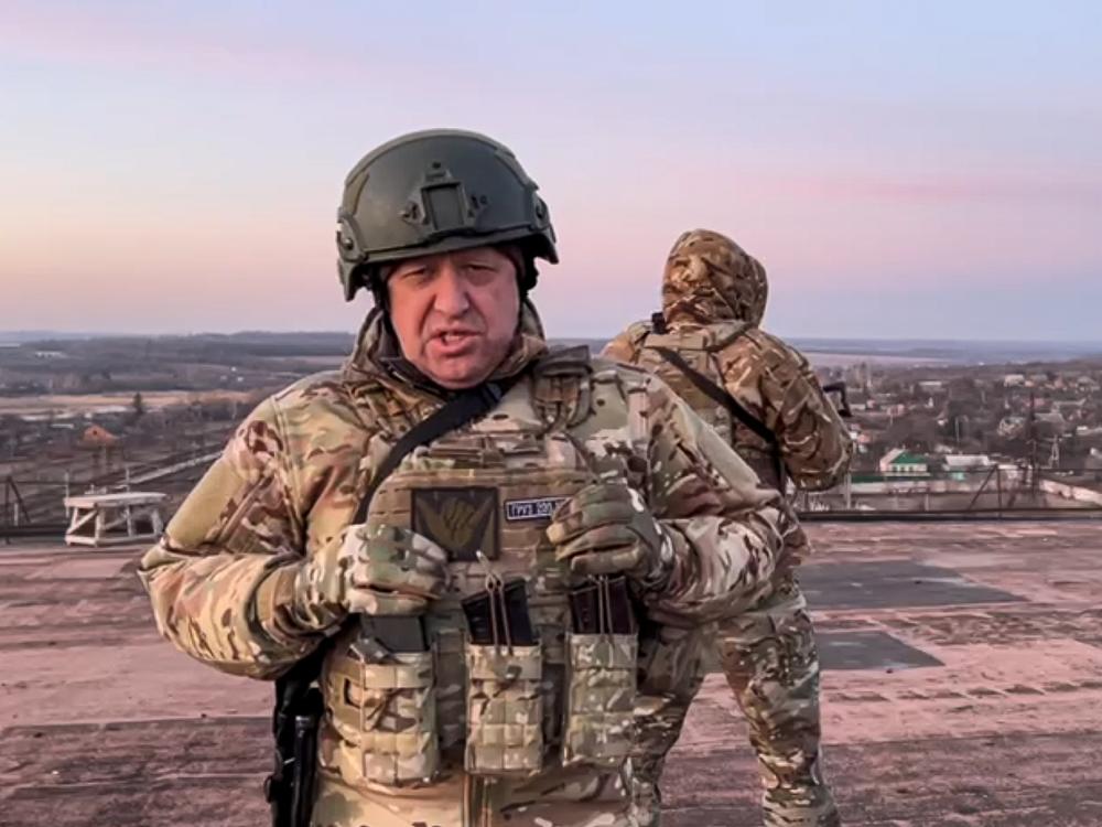 In this handout photo taken from video released by Prigozhin Press Service on Friday, March 3, 2023, Yevgeny Prigozhin, the owner of the Wagner Group military company, addresses Ukrainian President Volodymyr Zelenskyy asking him to withdraw the remaining Ukrainian forces from Bakhmut to save their lives, at an unspecified location in Ukraine.
