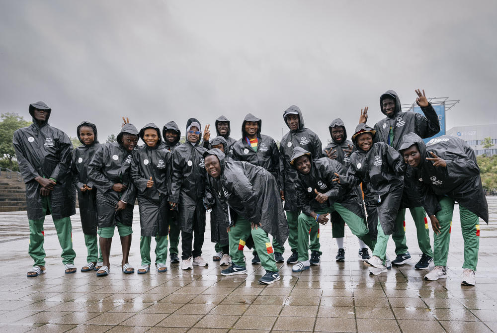 Ablaye Ndiaye (front row, center) poses with the Senegalese basketball team at the Special Olympics in Berlin. On Saturday, the team beat France to nail the bronze medal in 5-on-5 unified basketball. The coach says that Ndiaye, who has Down syndrome, brings energy and joy to the game and 