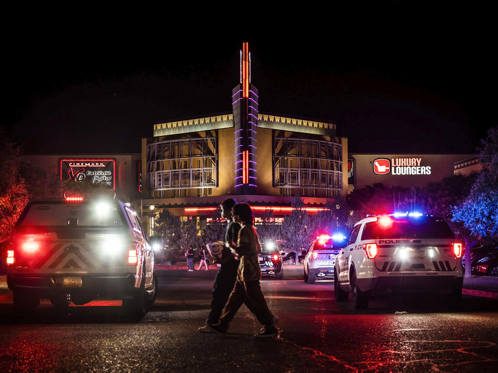 Movie-goers evacuate the Century Rio movie theater as officers respond to a shooting at the theater located at 4901 Pan American freeway in northeast Albuquerque, N.M., on Sunday, June 25, 2023.