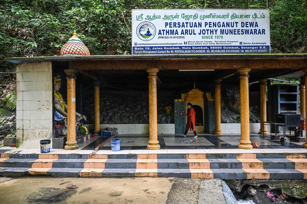 Loh Siew Hong prays at a temple in Gombak, Malaysia, May 30, 2022.