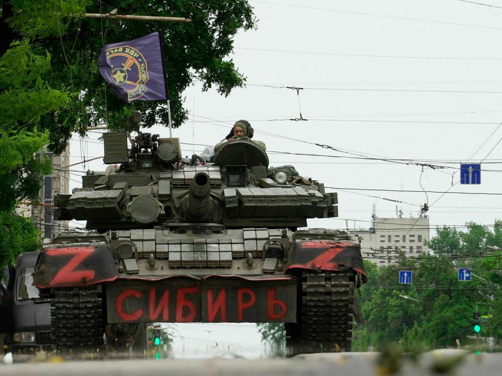 Members of the Wagner Group sit atop of a tank in Rostov-on-Don, Russia, on Saturday. President Vladimir Putin said an armed mutiny by Wagner mercenaries was a 