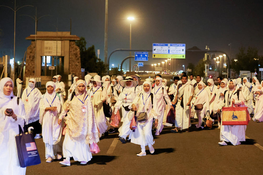 Muslim pilgrims walk to climb the Mount of Mercy at the plain of Arafat during the annual Hajj pilgrimage, outside the holy city of Mecca, Saudi Arabia, Monday.