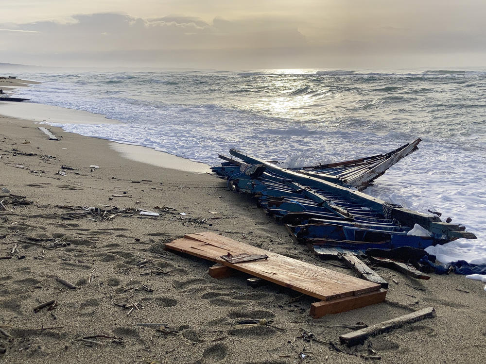 Wreckage of a capsized boat was washed ashore at a beach near Cutro, southern Italy, in February.