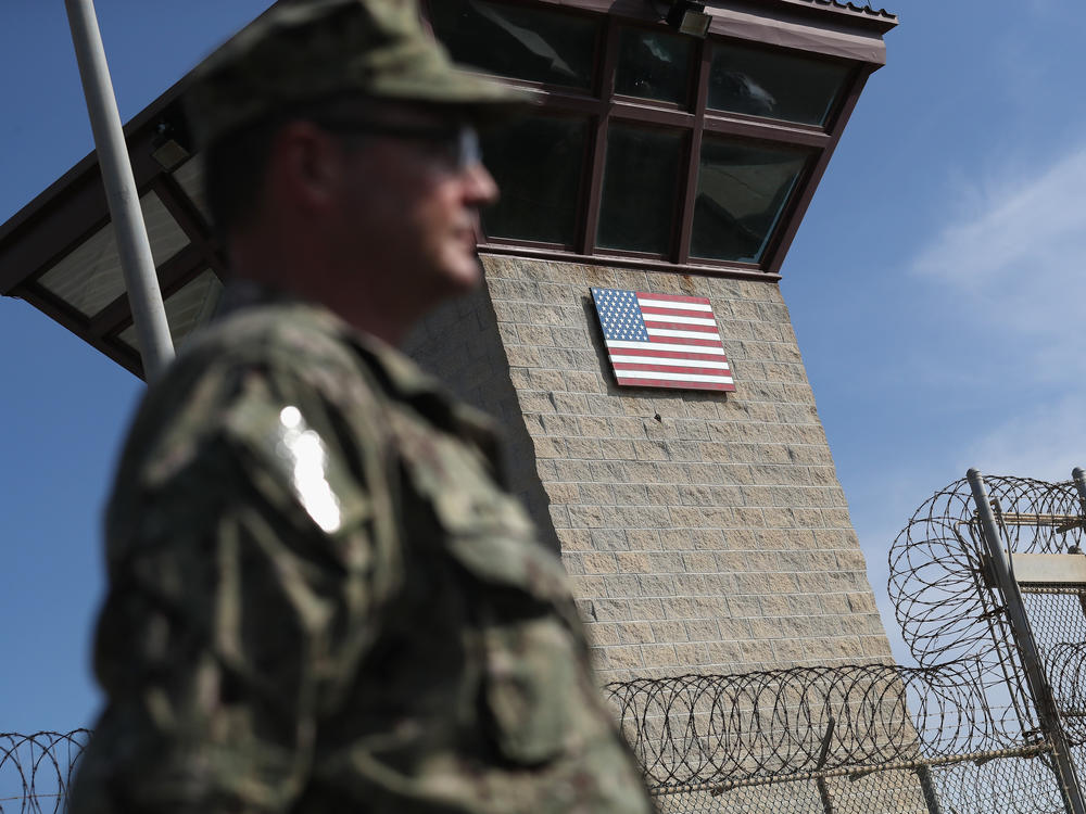 A U.S. Naval officer stands at the entrance of the U.S. prison at the U.S. Naval Station at Guantánamo Bay, Cuba, on Oct. 22, 2016.