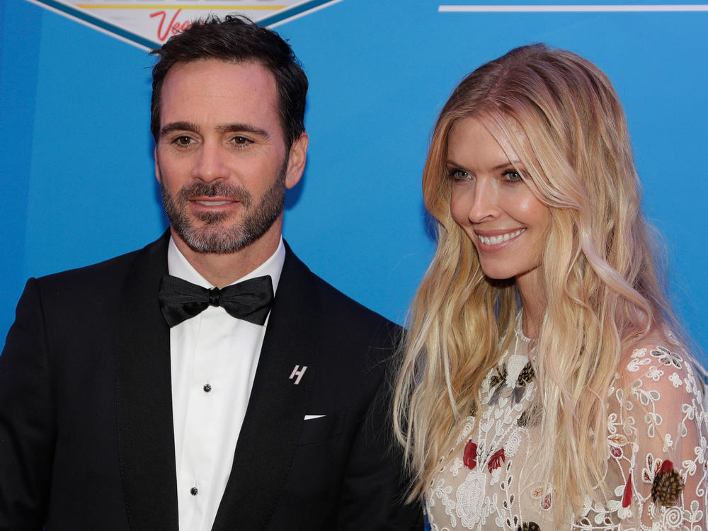 Jimmie Johnson and his wife Chandra Janway pose on the red carpet before the NASCAR Sprint Cup Series auto racing awards in Las Vegas, Dec. 2, 2016.