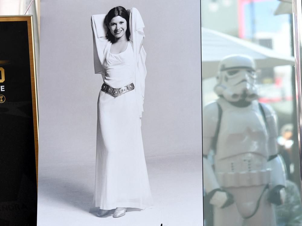 The newly rediscovered gown was screen-matched with the film and promotional posters, such as the one pictured here along the Hollywood Walk of Fame in May 2023.