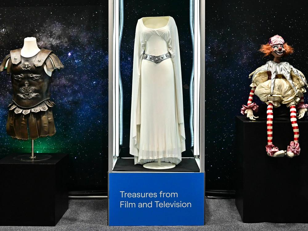 A dress worn by actress Carrie Fisher in the 1977 film <em>Star Wars</em> is one of 1,400 items up for sale at a live auction of film and TV memorabilia in Los Angeles this week.