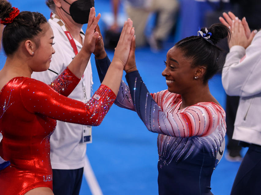 Sunisa Lee and Simone Biles of Team USA during the Women's Balance Beam Final at the Tokyo 2020 Olympic Games in August 2021.