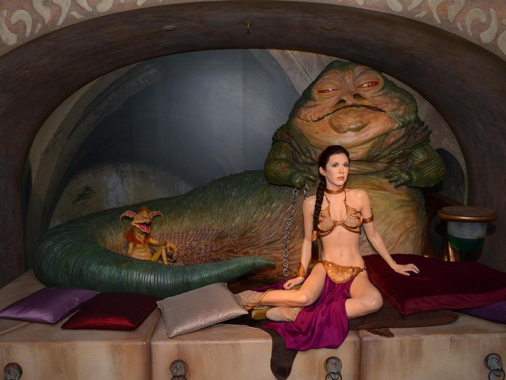 A wax recreation of the famous scene featuring Princess Leia in a gold bikini was displayed at London's Madame Tussauds Museum in May 2015.