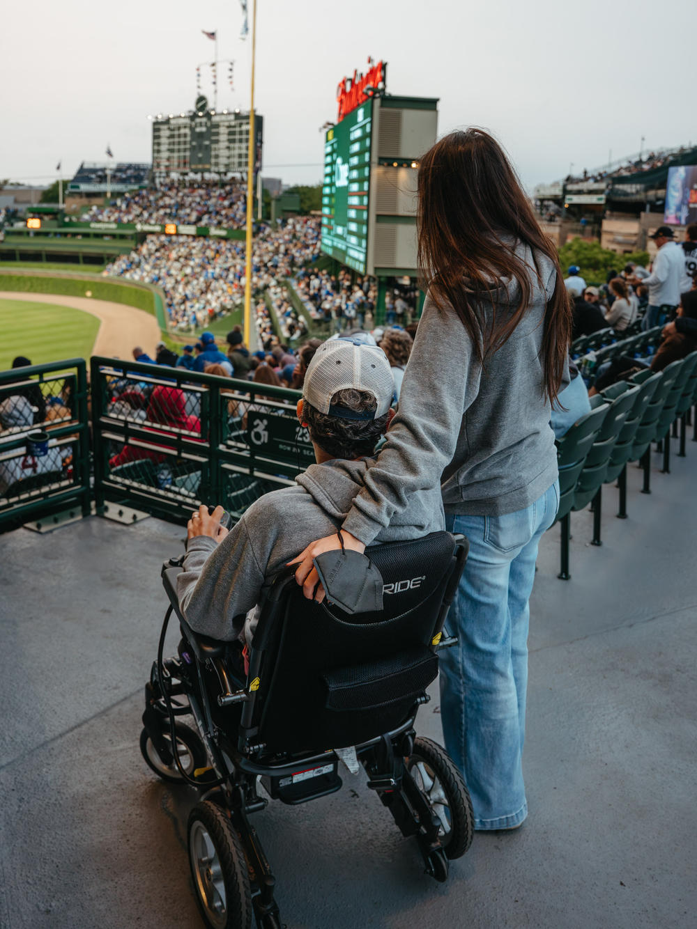 Wallach and his wife Sandra Abrevaya watch a Cubs game at Wrigley Field in June.