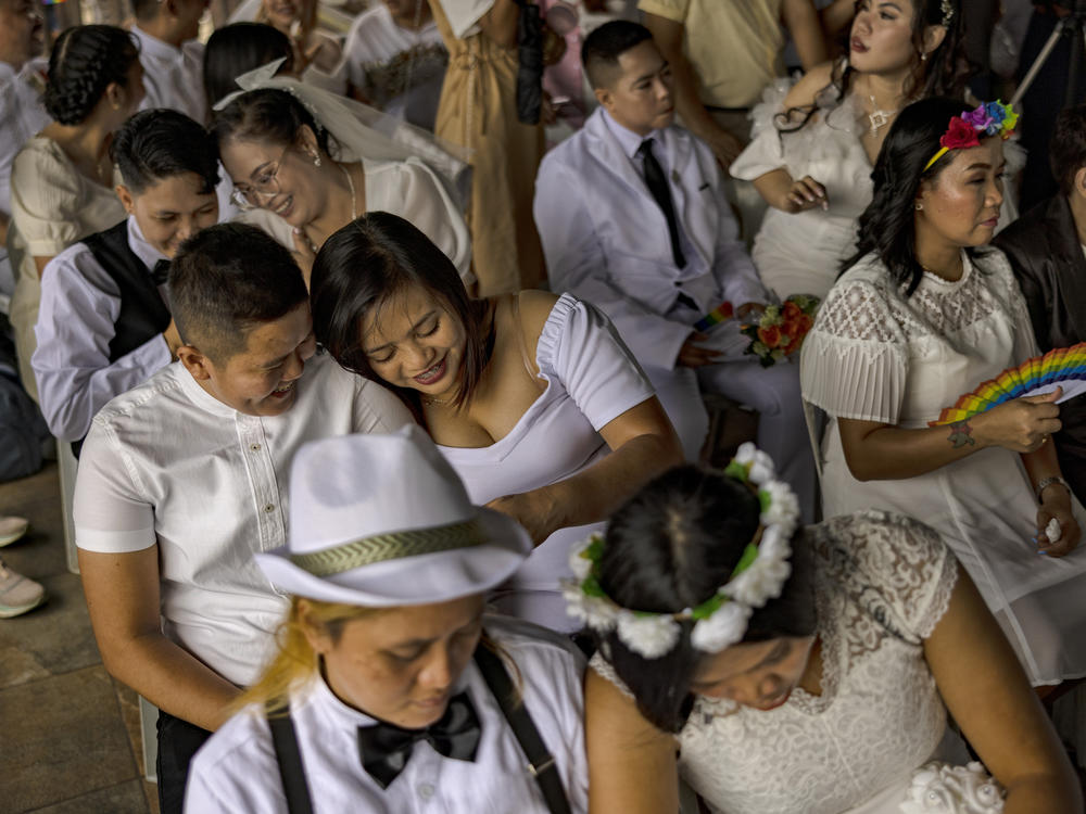 Filipino same-sex couples tie the knot in a mass wedding ceremony on June 25, 2023, in Quezon City in metro Manila, Philippines. In a symbolic act against the lack of comprehensive legislation for gender minorities in the Philippines, 29 same-sex couples tied the knot in a mass wedding ceremony organized by the LGBTS (Let God Be Thy Savior) Christian Church Inc.