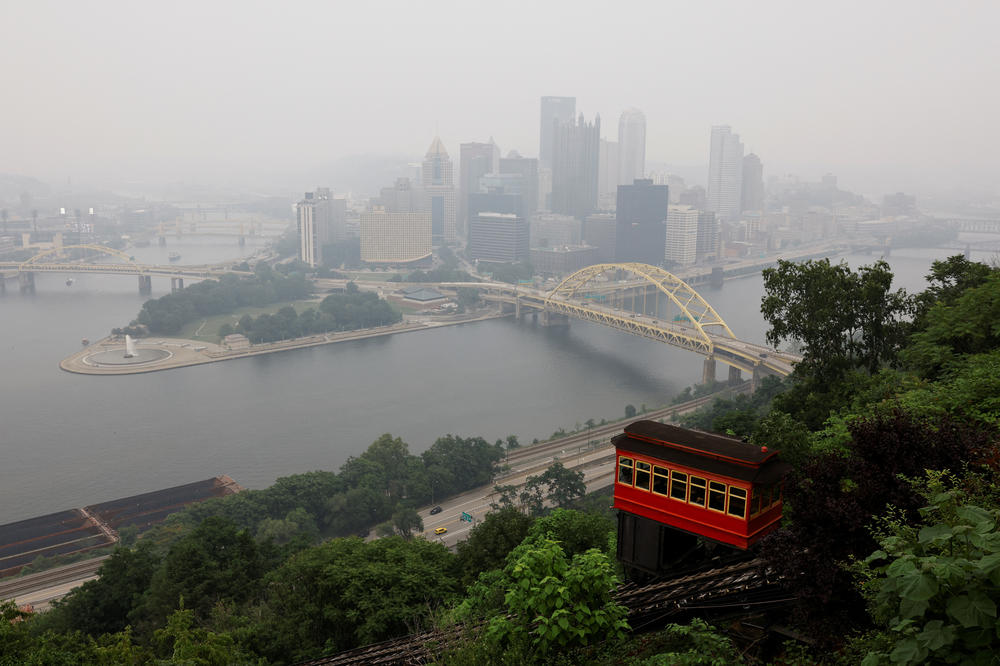 Pittsburgh's Duquesne Incline ascends Mount Washington as smoke, from Canadian wildfires, hanging over the U.S. Midwest and parts of the East Coast create hazy skies on Wednesday.