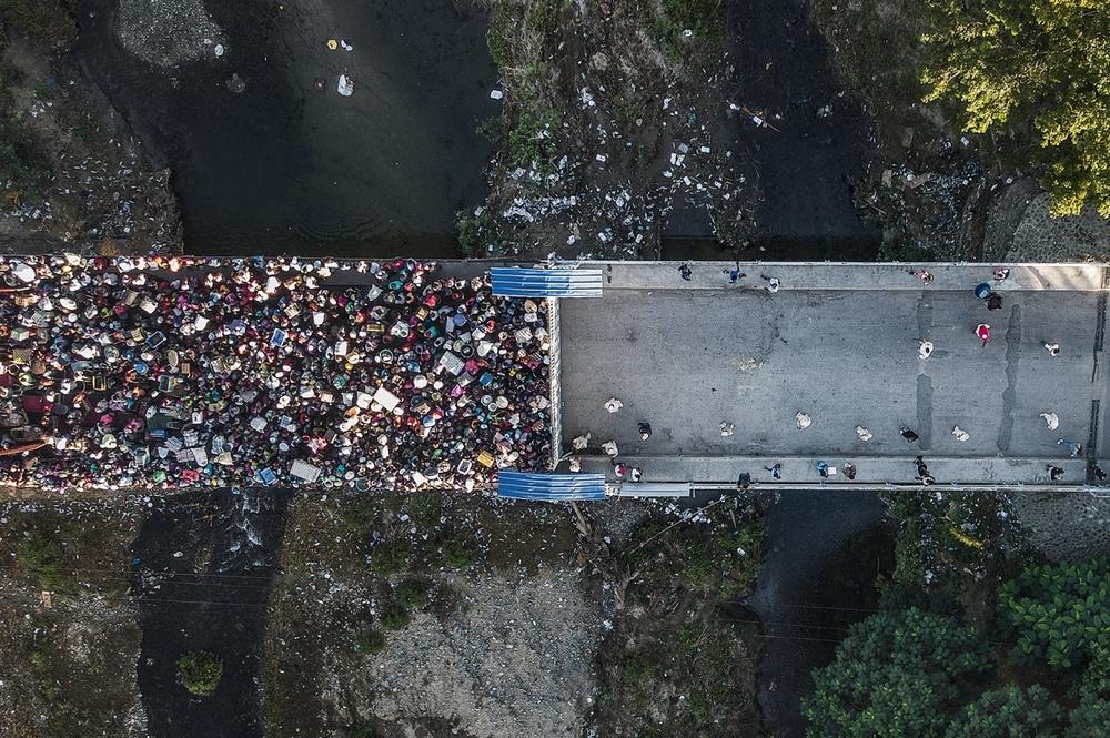 Haitians seeking to enter the Dominican Republic — the two countries share an island — mass at the border.