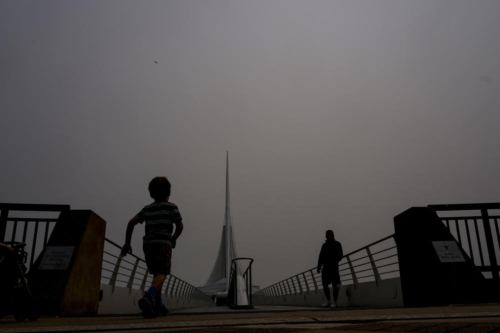 A haze is seen over the Milwaukee Art Museum on Tuesday. The haze from Canadian wildfires, which, along with higher ozone levels is continuing to create low visibility conditions and lead to Air Quality Alerts throughout the area.