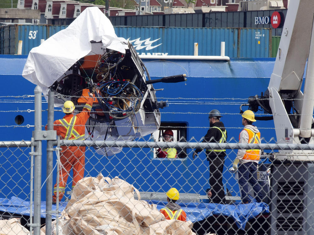 Debris from the Titan submersible, recovered from the ocean floor near the wreck of the Titanic, is unloaded from the ship Horizon Arctic at the Canadian Coast Guard pier in St. John's, Newfoundland, Wednesday, June 28, 2023.