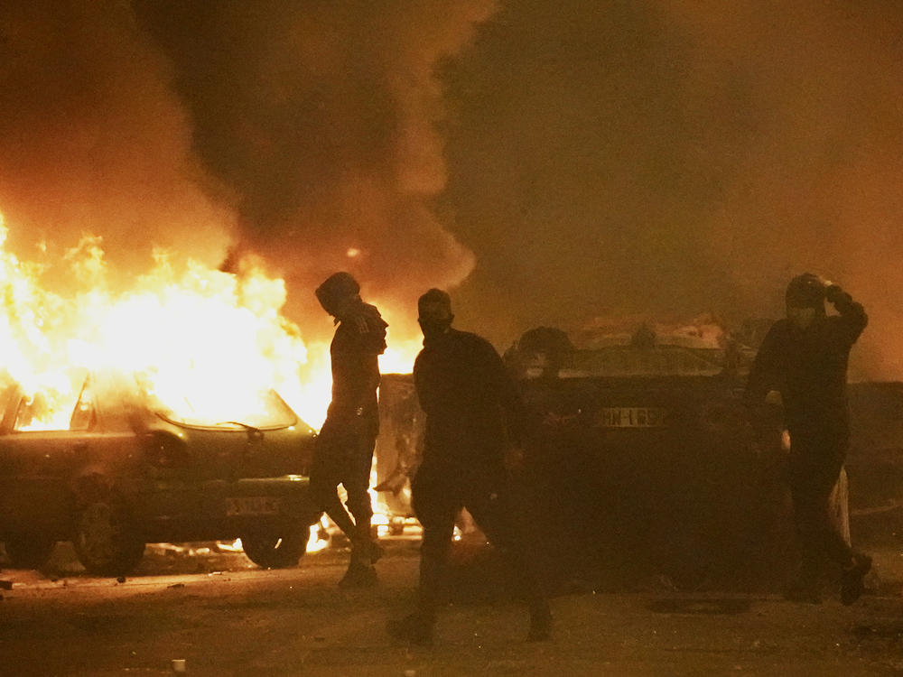 Youths clash with police forces as cars burn in Nanterre, outside Paris, Thursday, June 29, 2023.