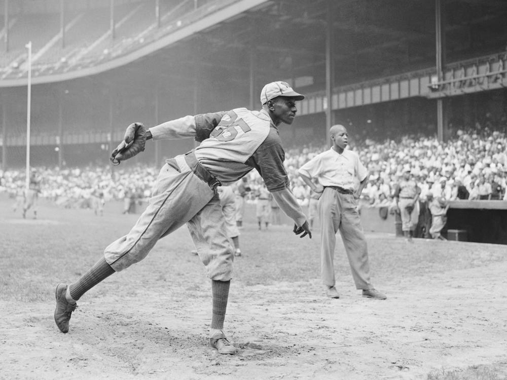 Kansas City Monarchs pitching great Satchel Paige warms up at New York's Yankee Stadium Aug. 2, 1942 for a Negro League game between the Monarchs and the New York Cuban Stars.