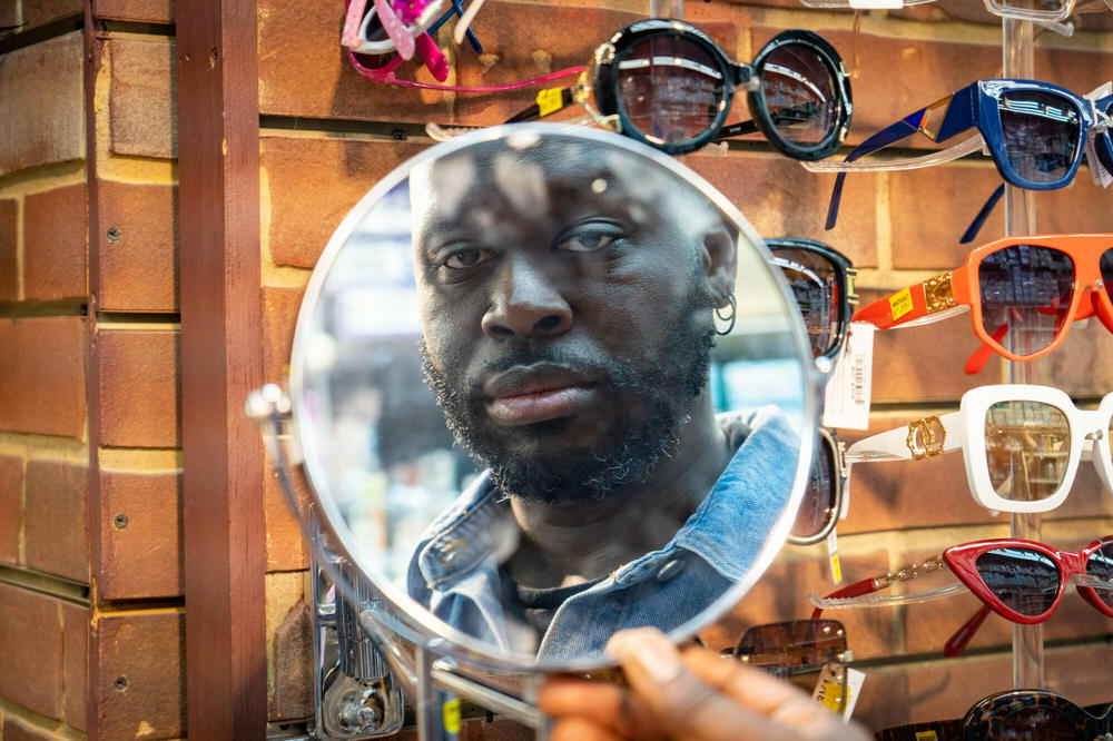 Bob looks in the mirror at Manhattan Beauty.
