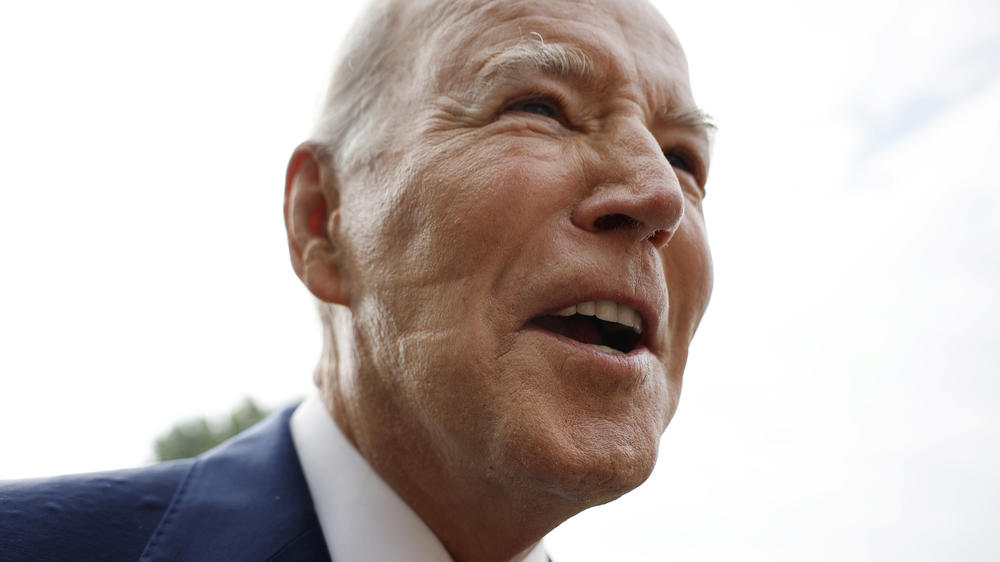 President Biden talks to reporters as he departs the White House on Wednesday. After reporters pointed out the marks on his face, the White House revealed the president used a CPAP machine, used by people who have sleep apnea, Tuesday night.