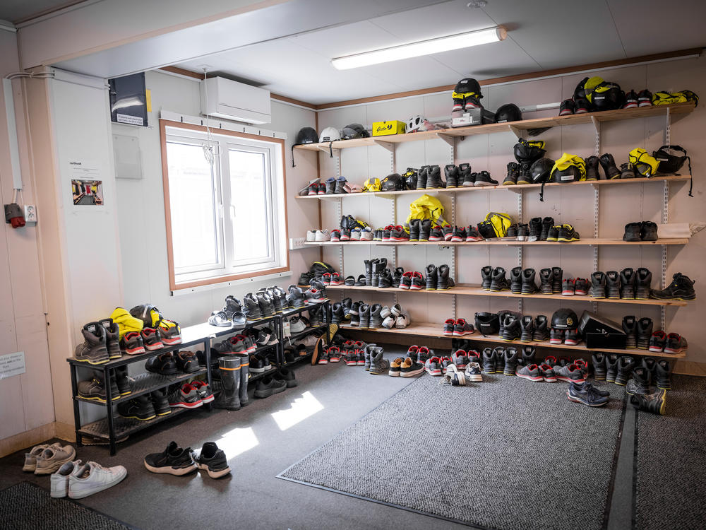 Employees' shoes and helmets at Northvolt battery plant in Skelleftea.