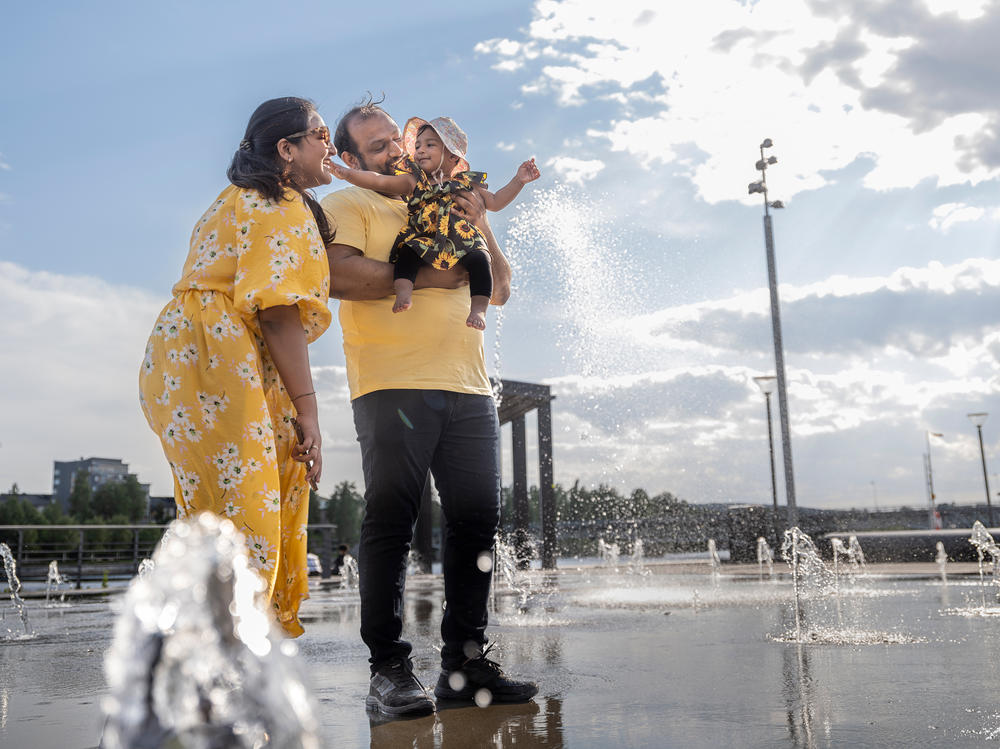 Neha Waqar, Habib Waqar and their baby Waniya at a park in Skelleftea.