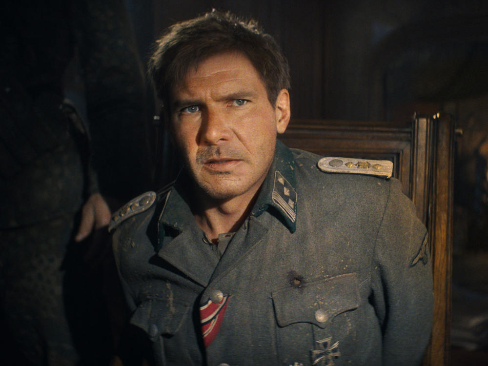 The excellent summer movie season is what's making Chris Klimek happy this week. Above, a digitally de-aged Harrison Ford in <em>Indiana Jones and the Dial of Destiny. </em>